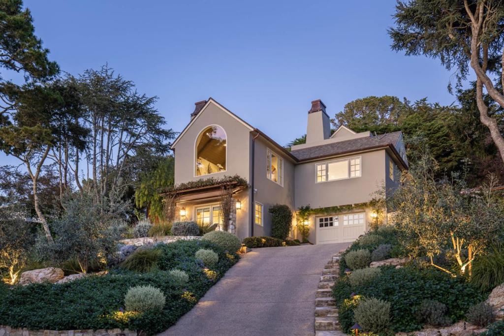 Nestled in the serene Carmel Woods neighborhood, this turnkey residence offers expansive Pacific Ocean views and seamless indoor-outdoor living. Designed and fully renovated by Stocker & Allaire in 2015, this home has been meticulously maintained and thoughtfully updated by its current owners. A sense of space and volume is enhanced by vaulted ceilings and a grand arched window framing a breathtaking ocean vista. The gourmet kitchen features all new Wolf appliances, a Sub-Zero refrigerator and spacious island with seating, marble countertops and a captivating ocean view. Enjoy several outdoor entertaining spaces including a large deck complete with a fireplace and built-in grill, multiple patios, two tranquil water features, and hot tub. The artfully designed gardens surrounding the property are an integral part of its charm, showcasing star jasmine, rosemary, camellias, roses, flowering vines, and citrus trees, ensuring a fragrant and vibrant environment year-round. Additional amenities include radiant heating, Lutron lighting, a Sonos sound system, instant hot water, a water conditioning system, an integrated alarm system, and an extra-large garage with two storage rooms. This special property combines luxury and comfort and offers easy access to downtown Carmel and the beach.