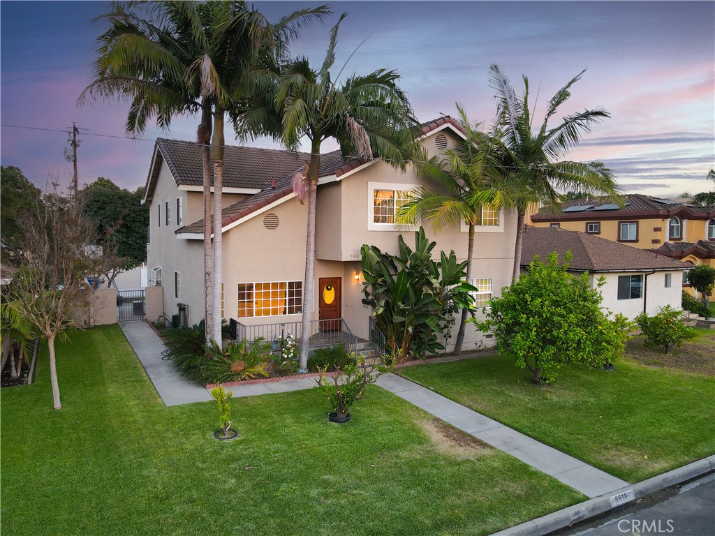 Spacious 5 bedroom, 3 bathroom home with 2 car detached garage, RV parking & extra bonus room around the corner from Griffiths Middle & Maude Price Elementary Schools in NW Downey. The interior includes a formal living room, entertainer's family room with cathedral ceilings, and a large primary bedroom with walk-in closet and spacious en-suite bathroom with dual sinks, jetted tub, separate tile shower, and balcony. The home was recently painted, new carpet on stairs, new light fixtures in bedrooms, and minor updates to give this large 2 story home a nice facelift. There are 3 bedrooms & 2 bathrooms upstairs and 2 bedrooms & 1 bathroom downstairs. There's an extra room attached to the detached garage, with a large room and a 3/4 bathroom. The property has alley access to the 2 car garage and park extra cars through the gate in the back.