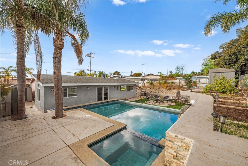 Welcome to your coastal retreat! This stunning single-story, newly painted gem blends timeless charm with modern luxury. Offering 3 bedrooms, 2 bathrooms, and 1,540 sqft of beautifully upgraded living space, this home sits proudly on a 6,800 sqft lot with an array of features designed to elevate your lifestyle. As you approach, the curb appeal captivates with meticulously landscaped turf in the front yard, vibrant roses, towering palm trees, and a beautiful step-up walkway leading to your front door. RV parking makes this property ideal for adventure enthusiasts, and the city views and cool ocean breezes provide a perfect backdrop for your everyday escape. Step inside to discover vaulted ceilings and a light-filled interior enhanced by skylights, large windows, and modern upgrades throughout. The entry welcomes you with gorgeous tile flooring that flows seamlessly into the heart of the home. The remodeled kitchen is a showstopper with brand-new countertops, dual ovens, custom cabinetry, and a stunning chandelier that makes every meal an occasion. The kitchen slider leads effortlessly to your private oasis—a backyard that redefines outdoor living. Your personal paradise features a brand-new pool, a luxurious spa, a cozy fire pit, and a garden ready for your green thumb. A large retaining wall provides privacy and structure to this entertainer's dream space. Whether hosting friends or relaxing under the stars, this backyard has it all. The spacious primary suite boasts a remodeled en-suite bathroom, vaulted ceilings, a skylight, and direct access to your backyard through a brand-new slider. Additional highlights include a modern fireplace in the living room, beautifully updated bathrooms, and an unbeatable floor plan that maximizes comfort and convenience. Located less than 10 miles to the beach, under 1.5 miles to Highway 78, and surrounded by fantastic schools, shopping, dining, and entertainment, this property is perfectly situated for an unparalleled lifestyle. Best of all, no HOA and no Mello-Roos mean you can enjoy everything this home offers without compromise. Whether you're looking for a starter home, a forever home, or the ultimate vacation-like retreat, this property delivers. Don’t miss the chance to make this your dream come true—schedule your private showing today!