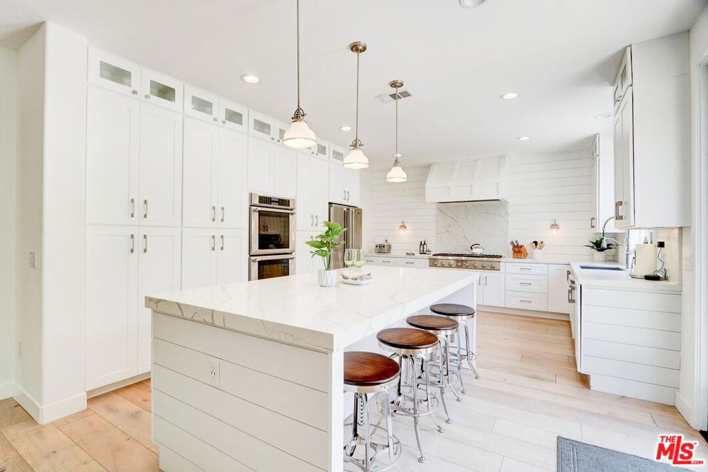 Lovely Modern Farmhouse Kitchen & Immaculate Home in one of THE MOST DESIRABLE locations in all of Dos Vientos! Welcome to 5081 Via Camino. A beautiful partially updated 4-bedroom (3 up 1 down), 3-bathroom home plus a dedicated office, nestled on a private cul-de-sac and only steps away from one of the numerous local trail heads in the area. This light-filled residence blends timeless farmhouse charm with contemporary elegance, highlighted by an entertainer's dream kitchen. Step into the heart of the home and fall in love with the crisp white cabinetry, high-end stainless steel appliances, double ovens, a professional-grade range, and gorgeous marble-look quartz countertops with waterfall edges. The expansive island provides ample seating and seamlessly connects to the open-concept living and dining areas perfect for family gatherings or casual mornings at the breakfast bar.Shiplap walls, designer pendant lighting, and thoughtful built-ins add warmth and character, while abundant storage ensures both beauty and functionality. Enjoy direct access to miles of scenic hiking trails, multiple community parks including the Dos Vientos Community Center, and the award-winning K-8 Sycamore Canyon School all just moments from your doorstep.Don't miss the opportunity to own this exceptional home that truly has it all: style, location, and a welcoming community.