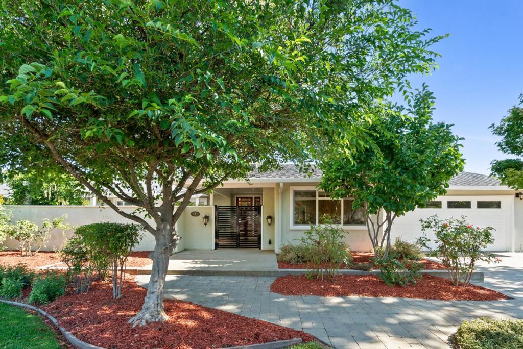 Welcome to 247 Marchmont Drive- a beautifully updated home in Los Gatos' desirable Hillbrook neighborhood. This 3-bedroom, 2.5-bath property sits on a spacious 10,250 sq ft lot and offers a quiet, private setting that feels like a true escape. A gated front courtyard provides a warm welcome. Inside, the open-concept layout connects the living room, dining area, and chefs kitchen, which features granite countertops, custom cabinetry, and top-of-the-line appliances including a built-in Sub-Zero refrigerator, Wolf 6-burner range, GE Café oven, and Uline wine cooler. Sliding doors open to the beautifully landscaped backyard, creating ideal indoor-outdoor flow for entertaining. The outdoor space includes a pool, spa, multiple seating areas, and a lush lawn. The spacious primary suite is a true retreat, offering a walk-in closet, spa-like bath with soaking tub, and a sliding door to the backyard. Located just minutes from award-winning Los Gatos schools, shopping, and dining, this home is the perfect place to settle in and enjoy the best of Los Gatos living.