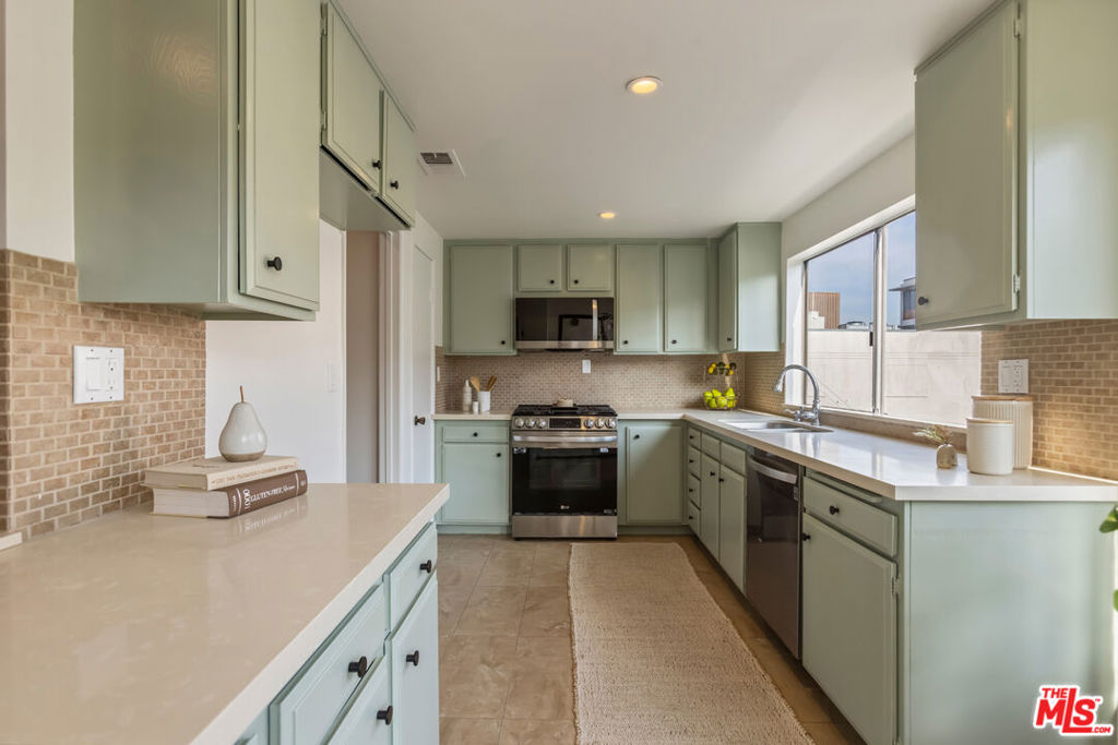 This move-in ready 2-bedroom, 2-bath condo (1,235 sq ft) sits right in the heart of Glendale. Step inside to a bright, inviting living room with a cozy fireplace, and a sunny kitchen featuring freshly painted cabinets. Both spaces open to a private balcony, creating an easy indoor-outdoor flow. The primary suite includes its own en-suite bathroom, and both bedrooms enjoy balcony access. With newer laminate flooring and updated appliances, the home feels fresh and modern throughout. Convenience abounds with in-unit laundry and central AC for year-round comfort. The building includes secure underground parking with two side-by-side spaces with private storage and elevator access. Just blocks from Brand Blvd and minutes from Porto's, Whole Foods, The Americana, the Galleria, great restaurants, and theaters , this is truly a walkers dream! Whether you're a first-time buyer or simply looking for a prime Glendale spot, this condo checks all the boxes.
