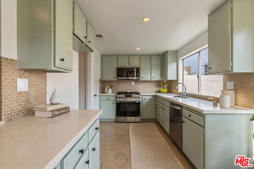 This move-in ready 2-bedroom, 2-bath condo (1,235 sq ft) sits right in the heart of Glendale. Step inside to a bright, inviting living room with a cozy fireplace, and a sunny kitchen featuring freshly painted cabinets. Both spaces open to a private balcony, creating an easy indoor-outdoor flow. The primary suite includes its own en-suite bathroom, and both bedrooms enjoy balcony access. With newer laminate flooring and updated appliances, the home feels fresh and modern throughout. Convenience abounds with in-unit laundry and central AC for year-round comfort. The building includes secure underground parking with two side-by-side spaces with private storage and elevator access. Just blocks from Brand Blvd and minutes from Porto's, Whole Foods, The Americana, the Galleria, great restaurants, and theaters , this is truly a walkers dream! Whether you're a first-time buyer or simply looking for a prime Glendale spot, this condo checks all the boxes.