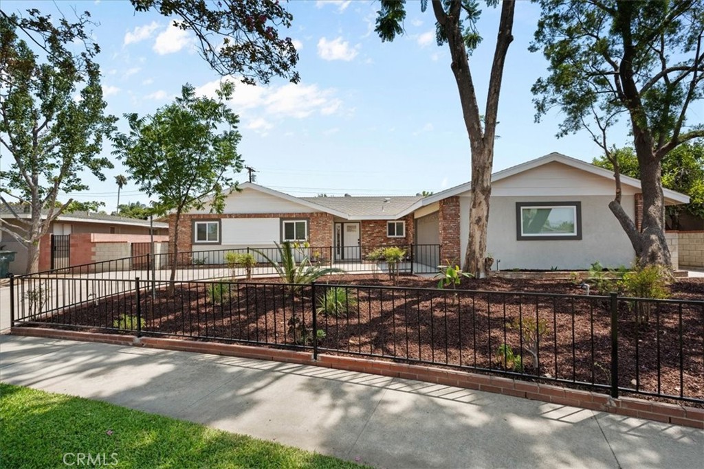 Welcome to this beautifully updated single-story ranch-style home, originally built in the 1960s and thoughtfully remodeled to blend timeless charm with modern comfort. Located on a quiet, established street, this home offers four generously sized bedrooms and two full bathrooms, providing plenty of space for families, guests, or a home office setup.
Step inside to discover fresh new paint, luxury vinyl plank flooring throughout, and new dual-pane windows that bring in abundant natural light while boosting energy efficiency. The galley kitchen has been tastefully upgraded with quartz countertops, white oak cabinets for a light, natural feel, and brand-new stainless steel appliances, creating a warm and functional space for everyday cooking.
An open-concept layout connects the kitchen to the living area, offering a seamless flow for relaxing or entertaining. Outside, the landscaped backyard, features block wall fencing for added privacy—perfect for outdoor gatherings, pets, or simply enjoying your own peaceful retreat. Also for added energy efficiency is a NEW HVAC system.
With its blend of modern upgrades, classic style, and generous lot, this move-in-ready home is a must-see for anyone looking for comfort, and space. Welcome HOME!