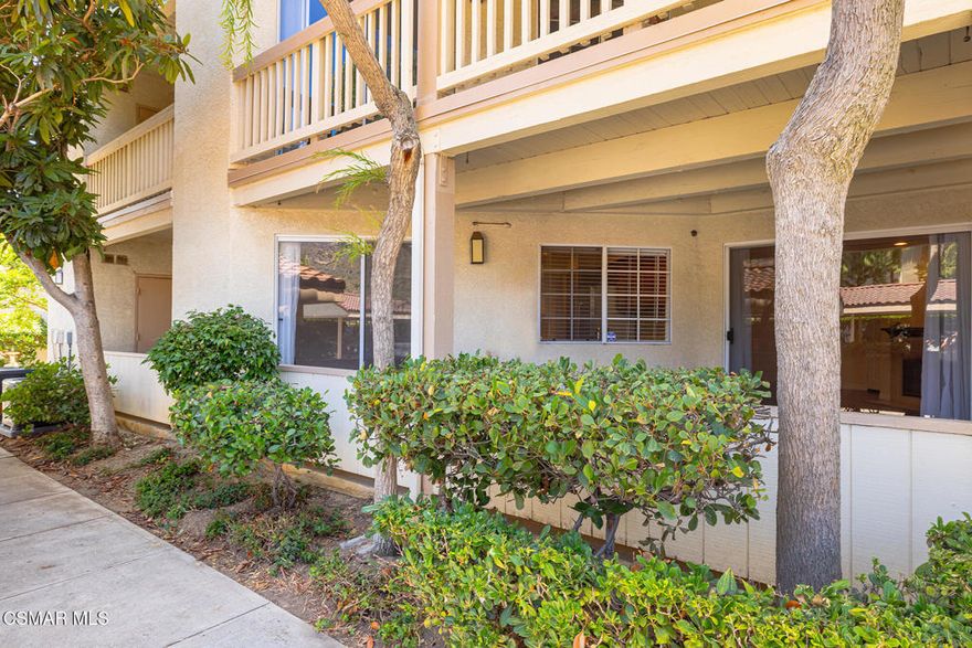 Nestled in the desirable Shadow Ridge community of Oak Park, this meticulously maintained ground-level home is located in the highly regarded Oak Park School District. Freshly painted and featuring warm, neutral tones throughout, this 2-bedroom, 2-bathroom unit boasts beautiful wood floors and an open-concept living and dining area, complete with a cozy fireplace and covered patio. The kitchen offers stainless steel appliances, granite countertops, and generous storage space. The spacious secondary bedroom features a sliding door that leads to a shared patio and just across the hall, you'll find a beautifully updated bathroom with a granite vanity and a tub/shower combo. The primary suite is a tranquil retreat, complete with a large walk-in closet and an updated en-suite bathroom featuring granite counters, a tub/shower combo, and a private patio. The unit also includes a laundry/utility room with space for a full-size washer and dryer. Shadow Ridge offers resort-style living, featuring two pools, tennis and racquetball courts, a volleyball court, gym, sauna, and clubhouse. HOA fees cover cable with HBO and Cinemax, high-speed internet, and fire and earthquake insurance. With its prime location, this home provides easy access to shopping, dining, top-rated schools, parks, and scenic hiking and biking trails.