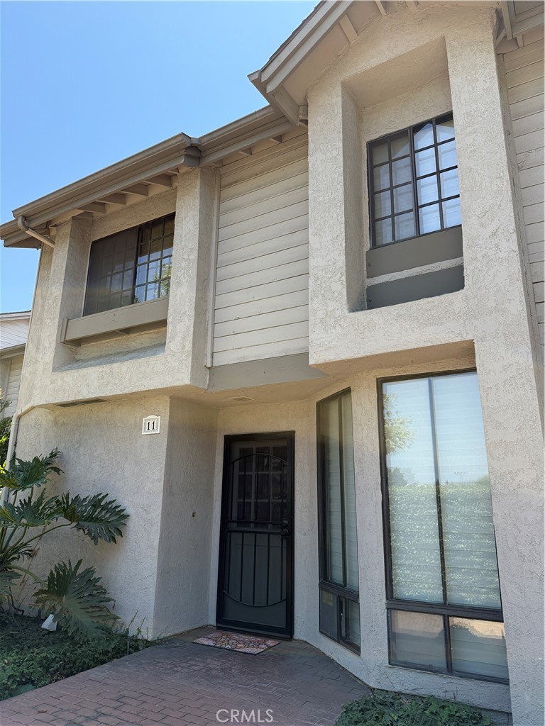 Upgraded 3 Bedroom, 2 1/2 bath Condo Located in Prime Fullerton Location Near Top Schools & Amenities
This beautifully remodeled condo is ideally located within walking distance of Troy High School, Fullerton College, and California State University, Fullerton. Enjoy the convenience of nearby Costco, Sam’s Club, and an abundance of shopping and dining options just steps away.
Despite its central location, the condo offers exceptional privacy and tranquility. The windows facing Chapman Ave are double-paned, and the private patio is enclosed by a tall fence/wall for added seclusion. Great location by the pool!!
The home has been thoughtfully upgraded throughout, featuring:
Fully remodeled kitchen with custom cabinets and built-ins, quartz countertops with a designer backsplash, laminate wood flooring, loads of natural light and an open concept dining and family room.
Primary suite has vaulted ceilings, abundant natural light, a separate shower, jetted tub, and a balcony to relax on. The second upstairs bedroom has its own private bath that has also been remodeled. The third room is on the first floor, and is currently being used as an office/extended kitchen space.
This home boasts lots of storage and a detached 2 car garage. Come make it your own!