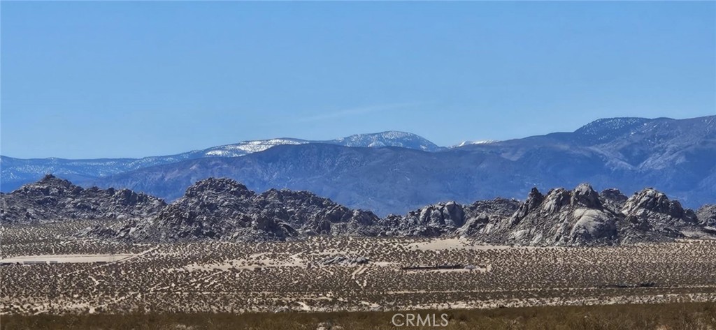Surround yourself with stunning mountain views on this 2.21-acre parcel in Lucerne Valley! With level land and wide-open space, this lot is perfect for a peaceful getaway, off-grid living, or an investment opportunity. Enjoy breathtaking sunrises and star-filled nights in this tranquil desert setting. Drive by today and check it out for yourself! APN: 0448-201-04-0000. Latitude:34.527983, Longitude:-116.778761.
