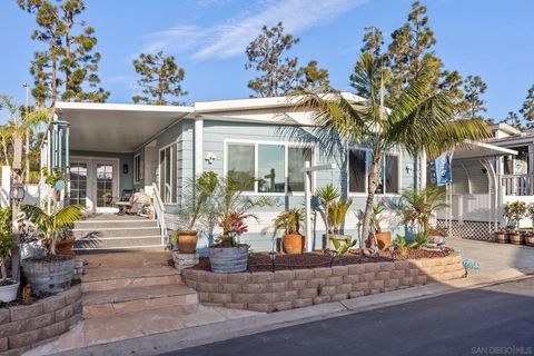 Photo of 7326 San Bartolo St #220, Carlsbad, CA 92011 (MLS # 260002541SD)