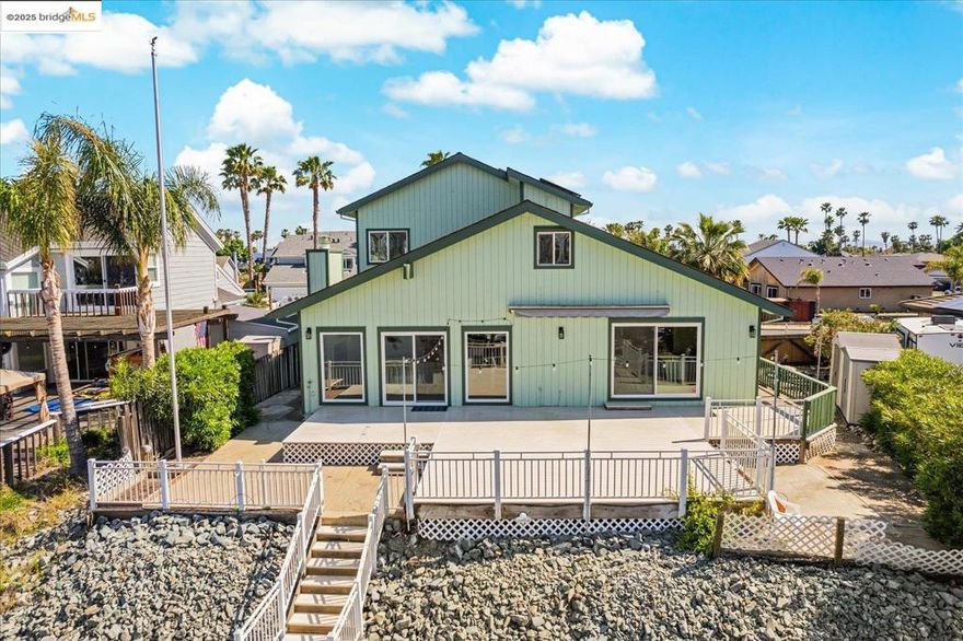Welcome to the heart of Discovery Bay! This beautifully remodeled deep-water home offers the perfect blend of luxury, comfort, and functionality. Featuring a spacious owner’s suite on the main level with a spa-like bathroom.  Enjoy the Desirable Northern Exposure from your Back Deck.. Relax and Live Where You Play.    Recently updated with modern finishes throughout, this home also boasts one of the largest side-access yards in Discovery Bay, providing ample room for your RV, trailer, or other recreational toys.  Upstairs, soaring high ceilings lead to a generous loft, additional bedroom with a full bath, and a bonus room ideal for a home office or flex space—perfect for multi-generational living or guests.  Stay cool and energy-efficient all summer long with owned solar panels, a newer HVAC system, and premium Anderson windows. Outside, enjoy warm evenings on your spacious deck or take advantage of the newer dock with direct water access—perfect for boating or waterfront entertaining.  This turn-key home is ready for you to enjoy summer 2025 in true Delta style. Don’t miss this rare opportunity to own one of Discovery Bay’s finest!