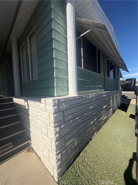 Photo of 13393 Mariposa Rd #114, Victorville, CA 92395 (MLS # HD26009111)