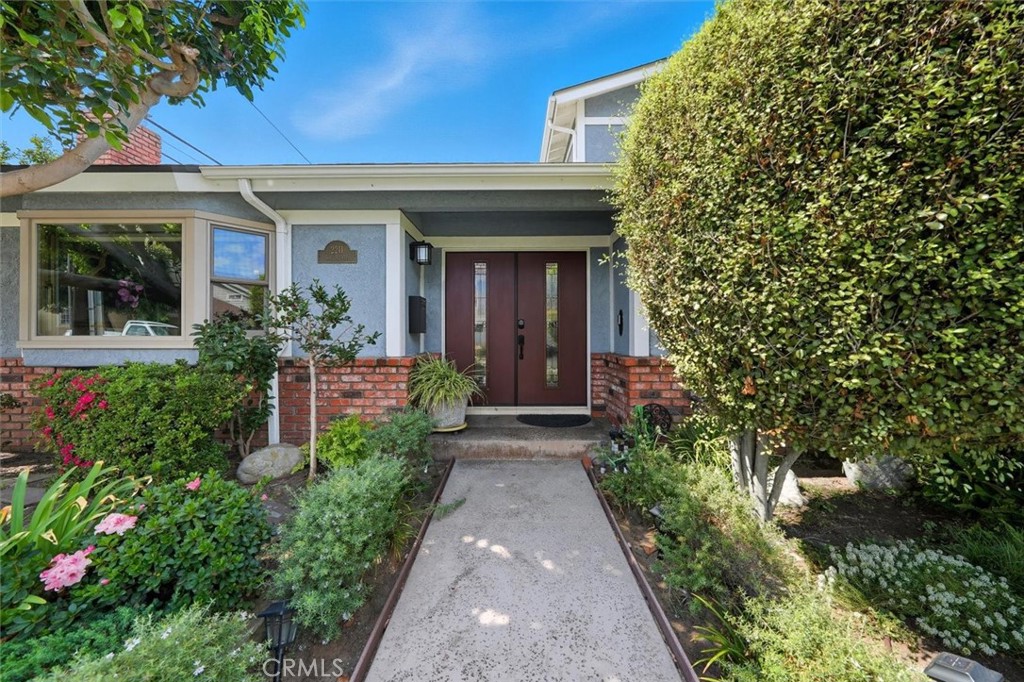 This beautifully maintained 4-bedroom, 3-bathroom townhome sits on an oversized lot and offers an exceptional layout that lives like a single-family home. Step inside the beautiful double door entry to find gorgeous bamboo flooring throughout the home complemented by chiseled-edge travertine in the kitchen and other custom travertine. The thoughtfully designed floor plan includes a formal living room with a bay window, vaulted ceilings, updated fireplace, customized lighting, TV and surround sound system, a built in bookcase and a sliding door that opens to the backyard. Downstairs you will also find a separate family room with custom lighting which opens to the yard along with one full bedroom and bathroom with Wainscoting on the walls – perfect for guests or multi-generational living.
Adjacent to the family room you will find a spacious chef’s kitchen featuring: Professional Viking 6-burner range with canopy hood. The owner added a newer stainless refrigerator, double convection oven, microwave and warming drawer. Other features include Granite countertops and abundant customized cabinetry. Andersen windows and doors were added throughout along with custom window coverings for enhanced comfort, style, and energy efficiency. Additionally downstairs there is a large laundry room with built-in storage and direct access to the peaceful backyard with a flowing fountain.
The second floor offers three additional bedrooms with crown molding including a beautiful primary suite with French doors, custom closets, updated bathroom and ceiling fan. All the bedroom closets feature custom built-ins for maximum organization.
The outdoor living space is perfect for entertaining with Privacy, lush backyard with mature flowering plants and trees. There is custom evening lighting throughout the backyard as well and a newer vinyl fence. There is a newer roof, whole-house water softening system, water filtration in the kitchen and an attached 2 car garage with abundant storage and Tesla charger.
From its thoughtful design to the well appointed finishes, this home offers unmatched comfort and function — all in absolutely beautiful condition. Shopping, restaurants, South Bay Hardware, 2 pre-schools and Madison Elementary school are right around the corner. Freeway access is superb as well.
