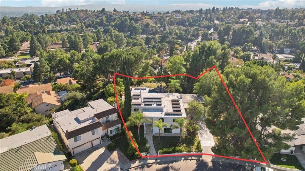 Photo of 12426 Henzie Place, Granada Hills, CA 91344 (MLS # SR25246854)