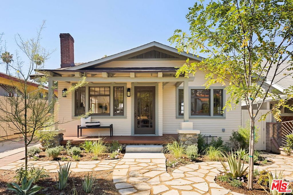 Perched on a natural rise sits this enchanting character compound. A one-of-a-kind California Craftsman, thoughtfully reimagined with charm and sophistication for indoor/outdoor living. This Highland Park property features 3 bedrooms, 2 bathrooms, and a beautifully finished studio. Step in and you're greeted by an array of colors from native flora, whimsical pathways, and an inviting sitting porch. Inside, you'll find a warm, inviting layout framed with original wood casement windows that fill the living space with abundant natural light and vibrant energy. A large dining space that can easily seat the entire family. Two sizeable bedrooms access a tastefully designed bathroom with a full-sized bathtub. The primary ensuite is a true retreat, roomy, serene, with a spacious closet and direct backyard access. The ensuite bathroom has a spa-like ambiance with wood paneling, large vanity, and frameless open-air shower. The kitchen is timeless, first class with custom cabinetry, tasteful fixtures, stone countertops, and a full suite of new appliances. Make your way out back, and you'll find a symphony of nature and design offering a variety of spaces to enjoy. The versatile patio is perfect for enjoying alfresco dining, hosting friends, or just lounging under the sun. For the imaginative thinkers, entrepreneurial spirits, and entertainers, there is a spacious detached studio cohesively designed with the main house. A leisurely stroll to the vibrant energy of York Boulevard, where renowned restaurants, cafes, and boutiques await.