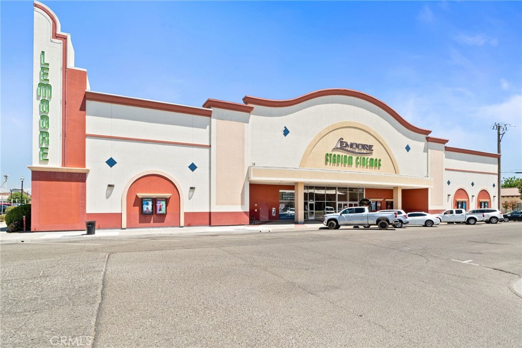 Approximately 32,000 sqft building in Downtown Lemoore currently operating as a 10-screen stadium movie theater. Zoned Downtown Mixed-Use, allowing for a wide range of uses including retail, professional office, hospitality, or residential. Partial second story offers additional development potential. Constructed with 8-inch concrete block walls grouted solid for superior soundproofing and structural integrity. Includes 782 solar panels for significant utility savings. Located near Leprino Foods, one of the world’s largest cheese manufacturers, and the Lemoore Naval Air Station, the Navy’s largest Master Jet Base. Versatile layout and sustainable features make this property ideal for investors, developers, and entrepreneurs.