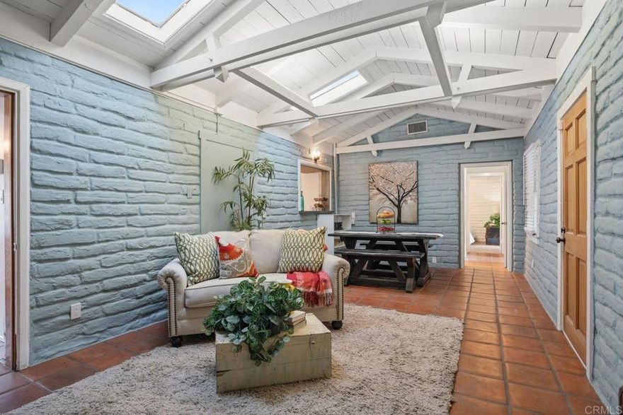 Welcome home to your very own unique adobe home oasis! This home sits on over 1.44 acres with ancient oak trees all around you and the natural Escondido Canal running through the property. Enter through an electric gated driveway to the 2-car detached garage and home. This home welcomes you through a large enclosed screened porch to enjoy, relax or watch nature. Step through the front door into a warm open living room/dining room area that includes high open beam ceilings with a wood burning brick fireplace and a pass-through opening from the kitchen perfect for entertaining. There is a side entrance foyer area off the living room to the breakfast/office nook area that leads you into the kitchen that offers a refrigerator, stove, microwave rangehood, new dishwasher and a double sink. This home offers 3 bedrooms in different sizes, 2 with new carpet and the middle bedroom having a large walk-in closet and a centralized hall bathroom. New window blinds throughout, central heating and air with additional heating elements in the home including a laundry closet. This wonderful property offers additional outdoor areas including several outbuilding/sheds to make all your creative ideas come true. There is also your very own additional spacious gated parking lot area in the lower part of the property.  Just minutes away from Lake Wohlford with fishing and boat rentals, parks, Bates Nut Farm, & Valley View Casino. Hurry this home won't last!