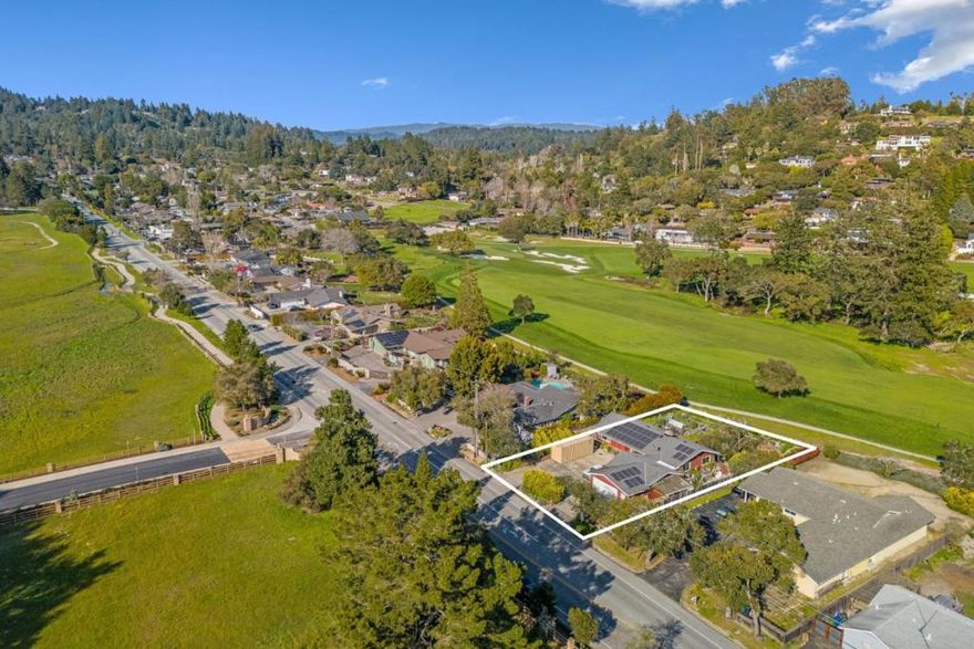 Perched along the 14th fairway, this charming single-level home offers stunning views, the best afternoon breeze, and a relaxing vibe. The peaceful backyard is perfect for seamless indoor-outdoor living whether you're unwinding in the hot tub, strolling through the lush gardens picking strawberries, or watching the red-tailed hawks soar above the majestic oak tree. Step into relaxation with the timeless vintage redwood sauna. The oversized lot offers space for boat or RV parking. Located in the Brooknoll Elementary District, you're minutes from downtown, UCSC, beaches, shopping, eateries, wineries, and brewpubs. And if you love the outdoors, Henry Cowell Redwood State Park is right outside your door, offering miles of scenic trails. A dreamy place to call home!