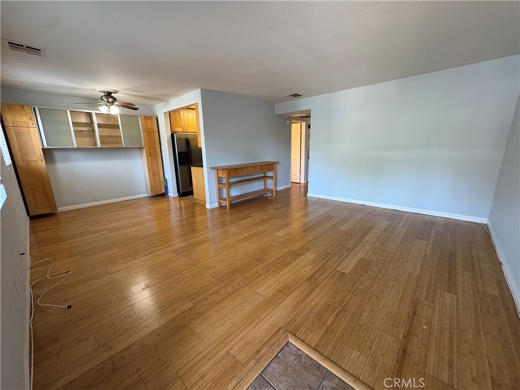 Spacious upstairs unit with bamboo flooring throughout, featuring two bedrooms with walk-in closets—one of which has a large private balcony. Includes in-unit washer, dryer, and refrigerator. Rent covers water, trash, and two assigned parking spaces. Located in a safe, gated community near restaurants, supermarkets, and the freeway. Part of the highly rated Walnut Valley Unified School District. Schedule a showing today!