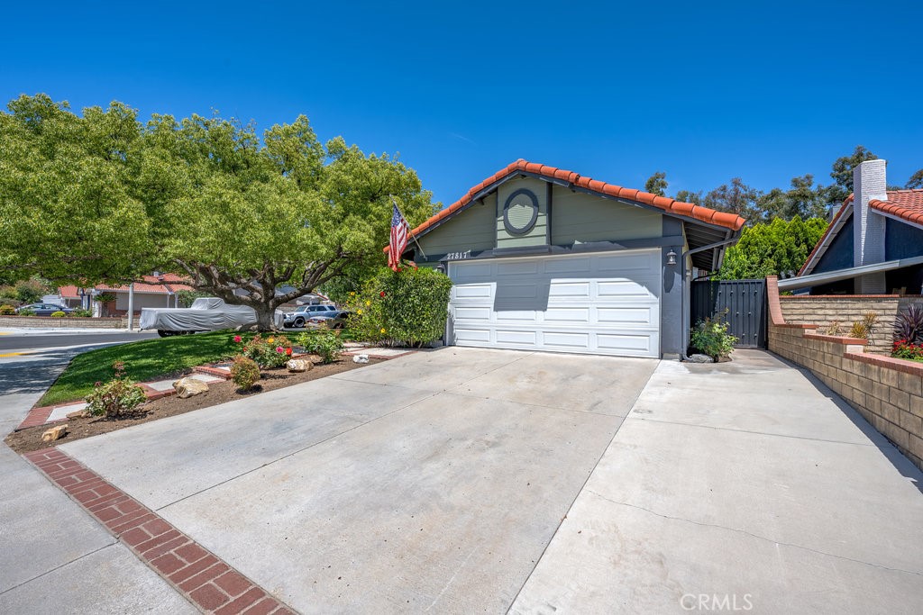 Welcome to your dream home at 27817 Wakefield Road, located in the tranquil community of Castaic, CA. This beautifully upgraded 3-bedroom, 2-bathroom single-family residence offers a perfect combination of contemporary design, thoughtful enhancements, and everyday comfort.
Upon entry, you're greeted by an inviting open floor plan featuring beautiful hardwood and tile flooring, recessed lighting, and fresh, modern paint throughout. The heart of the home is the stunningly remodeled kitchen, complete with upgraded cabinetry, elegant Copper Mist Polished quartz countertops by Silestone, a tasteful glass-inlaid backsplash, and premium stainless-steel appliances, ideal for casual meals or entertaining.
Relax in the warm and welcoming living area, highlighted by a charming fireplace, sophisticated mantle, and an integrated surround sound system that extends into the outdoor entertaining spaces. Double-pane windows, refined shutters, and contemporary blinds ensure comfort and energy efficiency. The spacious master suite provides a peaceful retreat, enhanced by sliding doors that grant direct access to the inviting backyard.
Both bathrooms feature meticulous remodels with premium tile, upscale fixtures, and elegant finishes, offering an ideal blend of luxury and convenience. Additional amenities include a versatile office space, fully insulated and sanitized attic, modern security system, and energy-efficient LED lighting in the garage.
Step into your private, beautifully landscaped backyard oasis, featuring high-quality artificial turf, a stylish vinyl pergola for relaxing in the shade, comfortable outdoor seating areas, and a practical Tuff Shed for extra storage. The home's exterior also includes a wrought iron side-yard gate, seamless rain gutters, and an upgraded garage door, enhancing both curb appeal and practicality.
Conveniently situated near top-rated schools, inviting parks, shopping centers, and accessible freeway routes, this residence embodies the ideal Southern California lifestyle. Welcome home to 27817 Wakefield Road—where style and comfort seamlessly meet.