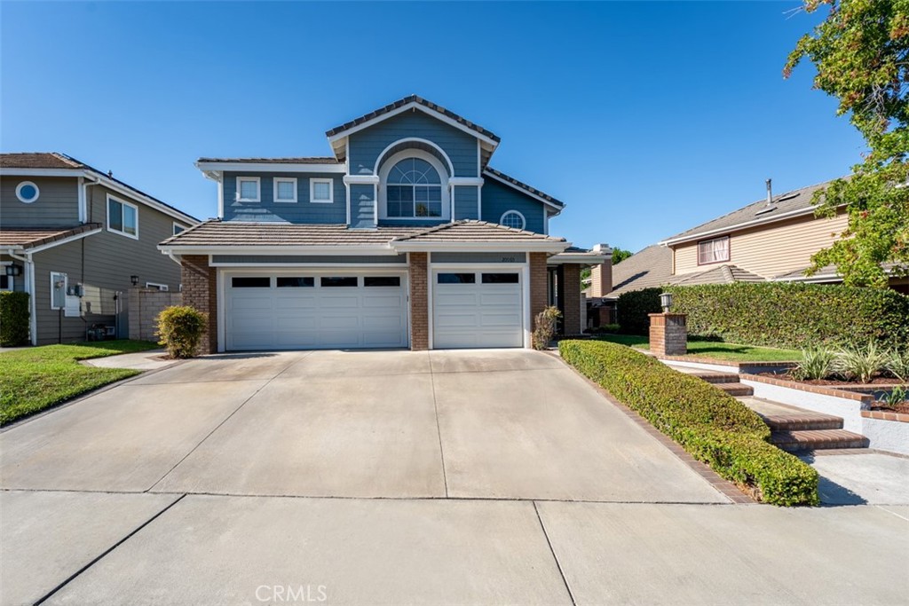 Welcome to Fairmont Terrace, a gated community offering privacy and convenience. This spacious 4 bedroom home, 3 baths with a loft and three-car garage showcases an open floor plan with thoughtful upgrades throughout. The main level features a bedroom and bath, perfect for guests or multigenerational living. Enjoy gatherings in the living room with a custom-tiled fireplace and wood mantle, a formal dining room with a dry bar and wine fridge, and a family room complete with fireplace, built-ins, and French doors that open to the backyard retreat. The remodeled chef’s kitchen boasts custom cabinetry, granite countertops, designer tile backsplash, stainless steel appliances including a Wolf six-burner cooktop, built-in Sub-Zero refrigerator, walk-in pantry, and a cozy breakfast nook. Upstairs, a versatile loft with ceiling fan complements two secondary bedrooms and the luxurious primary suite, featuring vaulted ceilings, dual closets including a custom walk-in, and a spa-like bath with quartz countertops, soaking tub, walk-in shower, and light-up mirrors. Step outside to a private oasis with a saltwater pool and spa with waterfall accents, fire pit, and plenty of room to relax or entertain. Additional highlights include: steamer shower downstairs, interior laundry, surround sound, water softener, updated HVAC, new carpet, wood flooring, garage with built-in cabinets and two EV chargers. Ideally located within the award-winning Plac/Yorba Linda school district and walking distance to parks and schools, this home combines elegance, function, and lifestyle in one perfect package. Your home search is over!
