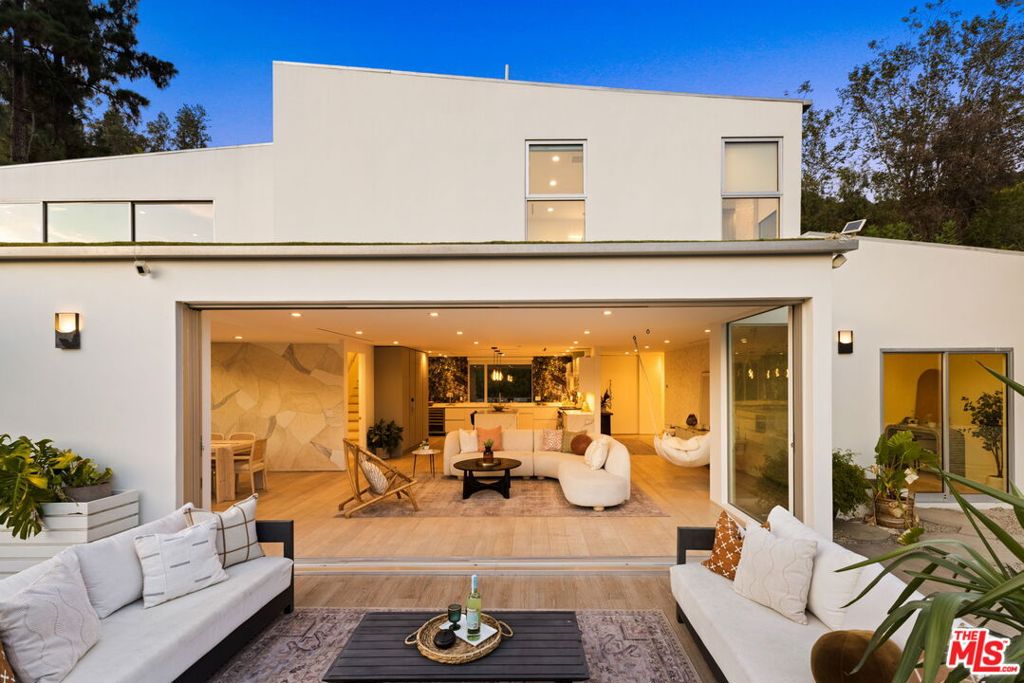 Recently updated home with sophisticated canyon vibes! This quintessential Hollywood Hills property shines with character, thoughtful updates, and modern upgrades throughout. Situated in the highly sought after enclave of Nichols Canyon, just minutes away from the Sunset Strip and all the city action. Open-concept floor plan with abundance of natural light that floods every room. Multiple outdoor spaces that are perfect for hosting a summer party or relaxing with a good book while listening to the sounds of the birds. Wide-plank wood floors and Fleetwood doors throughout. Any chef is sure to love this open-concept kitchen with cool canyon views, plenty of countertop space, and state-of-the-art appliances. Enjoy beautiful sunsets from the primary suite which boasts a pedestal soaking tub, waterfall shower and ample storage space. All bedrooms downstairs open directly to the backyard for the perfect indoor-outdoor SoCal living vibe. Laundry room with washer/dryer. Large private 2-car garage. Conveniently located within close proximity to Netflix, Sunset Gower and Paramount Studios, as well as Columbia Square. Walking distance to world famous hiking trails.This modern and peaceful canyon home is truly the ideal retreat for anyone looking to seek their own private refuge -just minutes away from all the city has to offer. ** Broker/agents do not guarantee the accuracy of square footage, lot size, or other information concerning the condition or features of property provided by the seller or obtained from public records.**