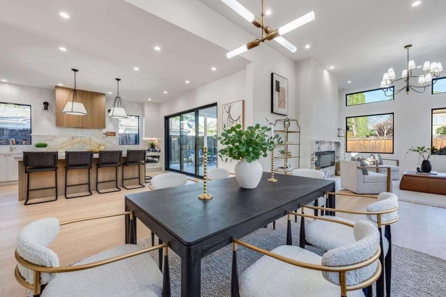 Newly built designer home by Owner's Logic Inc. Main residence is 4 beds, 3.5 baths, & 3,225 sq. ft. of living space, w/ a flexible attached 449 sq. ft. 1-bed, 1-bath ADU, on a spacious lot of 9,255 sq. ft. lot in Waverly Park. Bright open layout connects the living, dining, & kitchen areas w/ 12-ft great room ceilings, AB-grade hardwood floors & Visual Comfort lighting. A fluted limewash porcelain fireplace, custom staircase, & Milgard windows create a refined atmosphere. The chefs kitchen impresses w/ porcelain countertops & backsplash, a fluted wood hood, white & oak Crystal cabinetry, & Thermador appliances. Tongue-&-groove mudroom leads to the 2-car garage, while a 466 sq. ft. covered patio extends the living space outdoors. Primary suite features custom LED walk-in closet, soaking tub, & frameless glass shower. Bathrooms showcase Brizo faucets, Hansgrohe showers, & Toto toilets. ADU features custom walk-in closet & floating vanity, perfect for additional space or income. Smart features include Nest thermostats, Ring doorbell, Fittes air vents, & owned solar panels. Near Cuesta Park, El Camino Hospital, Grant Rd shopping & dining, Stevens Creek Trail & Downtown Castro St. Easy commute to Google, Apple, LinkedIn, Microsoft, Intuit, & Meta, plus top MV schools.
