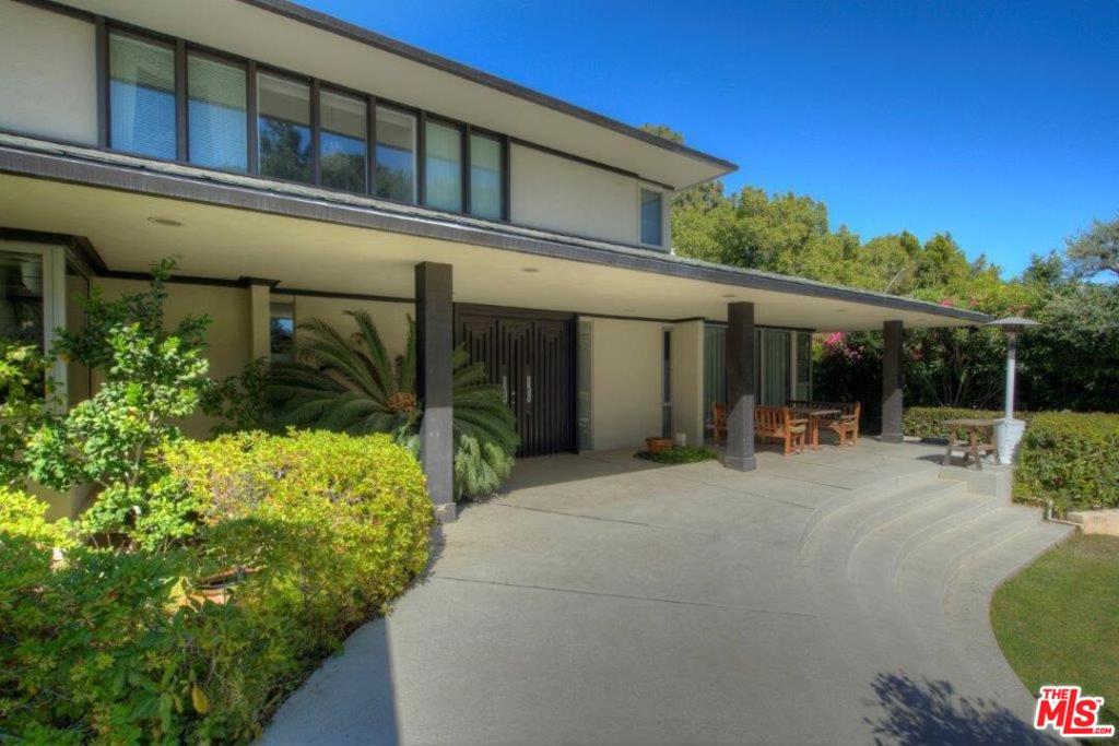Privately nestled on Billionaires Road on Beverly Hills most coveted desirable cul-de-sac North of Sunset Boulevard. Mid-century style, 3-story with approximately 5,600 sq. ft. on 20,364 sq. ft. Lot with 96 ft. frontage x 210 ft. depth, great open floor plan with 5 bedrooms, 6 baths, formal living, dining room, large open kitchen, family room, sunroom, laundry room, large basement bonus room perfect for child's playroom, movie theater, or additional family room, large pool, child's play gym, basketball court, putting green, beautiful landscaping, 2-car garage plus 2-carport, set behind gates offering privacy and security. Perfect celebrity hideout. Close to all of Beverly Hills finest restaurants, shopping and hotels.