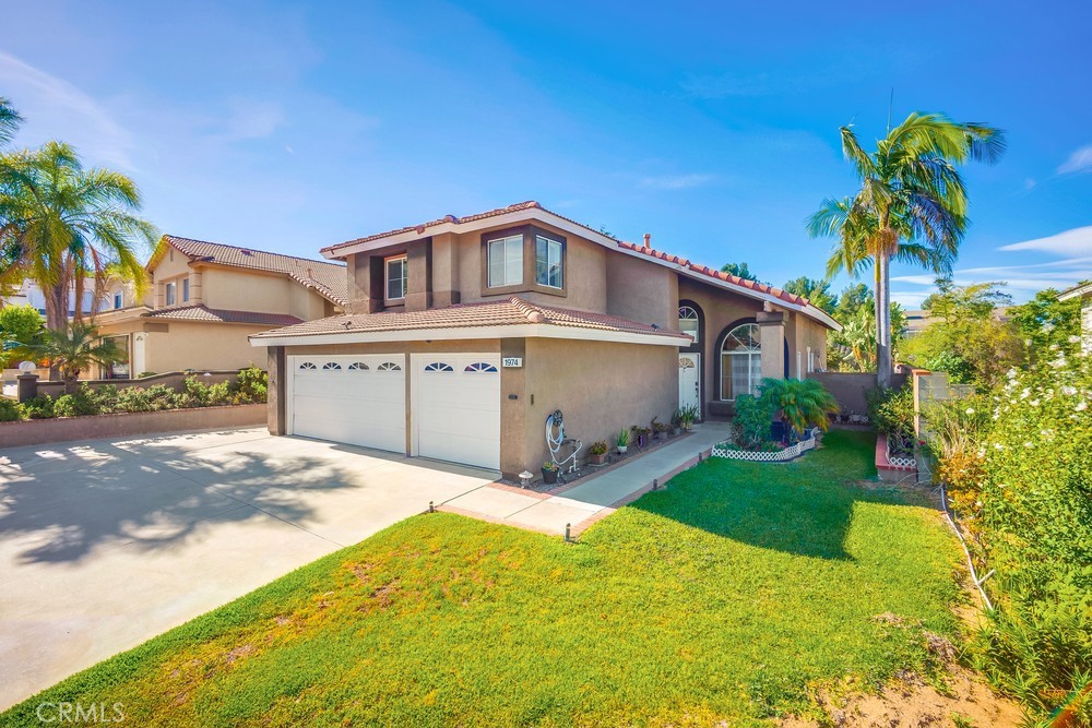 Welcome to this stunning, recently remodeled 4-bedroom, 3-bathroom turn-key home, complete with a versatile office/flex room and a spacious 3-car garage. Nestled within walking distance of Hidden Hills Park, this residence offers both convenience and tranquility. The expansive primary suite is a true retreat, featuring a cozy sitting area, a luxurious updated bathroom, and a private balcony with elegant tile flooring. Step outside to a large, private backyard—perfect for entertaining or creating your own garden oasis, already adorned with thriving tropical fruit trees for year-round enjoyment. Energy efficiency is a priority, with split-unit systems, central AC, evaporative cooler, and a whole-house fan to keep the home comfortable. Smart home features include a thermostat, sprinklers, front door lock, doorbell, and a security system for modern convenience. Upgraded with premium systems, including a state-of-the-art water softener and reverse osmosis filtration for pure, high-quality water throughout the home. The gourmet kitchen boasts a large island, sleek stainless steel appliances, and a stylish full-length tile backsplash. This home combines modern upgrades with timeless charm—ready for you to move in and make it your own!