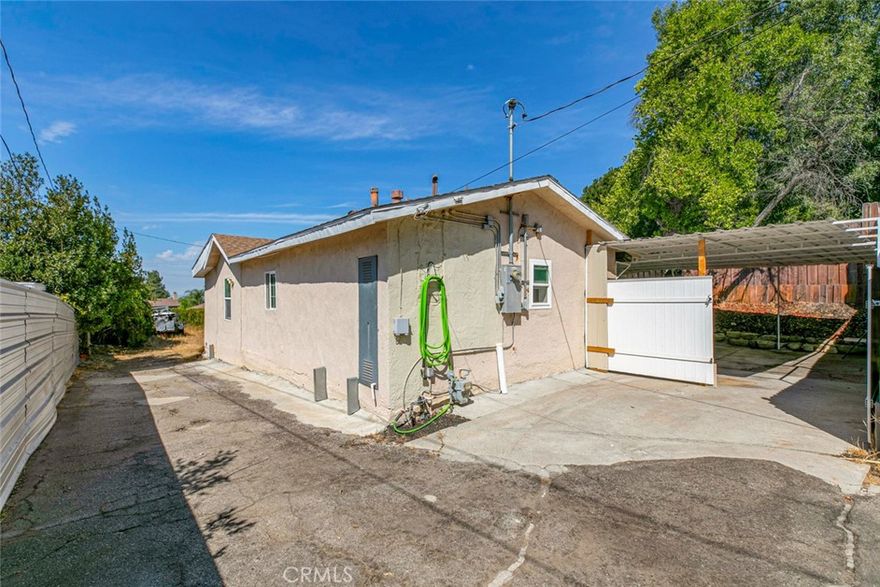 Welcome to this inviting 3-bedroom, 2-bathroom residence situated on a sprawling 14,616 square foot lot. Offering both comfort and functionality, this home is perfect for families, entertainers, or those in need of extra space.The generous lot with a long driveway provides ample parking with room for RVs, boats, and multiple cars, making it an ideal fit for those with recreational vehicles or a love for outdoor activities. Water and power are included in the rent, adding extra convenience and value. Don’t miss this rare opportunity to enjoy a home with incredible space.