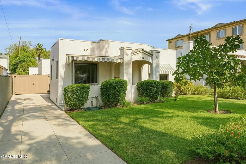 Welcome to this beautifully updated 3-bedroom, 2-bathroom home, offering 1,429 sq ft of comfortable living space on a generous 6,911 sq ft lot. Featuring stylish laminate flooring throughout, a cozy wood-burning fireplace, and a full bathroom with modern finishes, this home blends charm with convenience.The kitchen has been refreshed with new countertops and durable tile flooring, which continues into the spacious second living room--perfect for gatherings or a playroom. Two additional bedrooms and bathrooms were fully permitted, providing added space and value.Enjoy recent upgrades like dual-pane windows, a Nest thermostat for smart climate control, and a roof replaced in 2016. The attached 450 sq ft two-car garage comes with plans underway for conversion into a 2-bedroom ADU--ideal for rental income, guests, or extended family.Move-in ready with room to grow, this home checks all the boxes. Come see the potential for yourself!