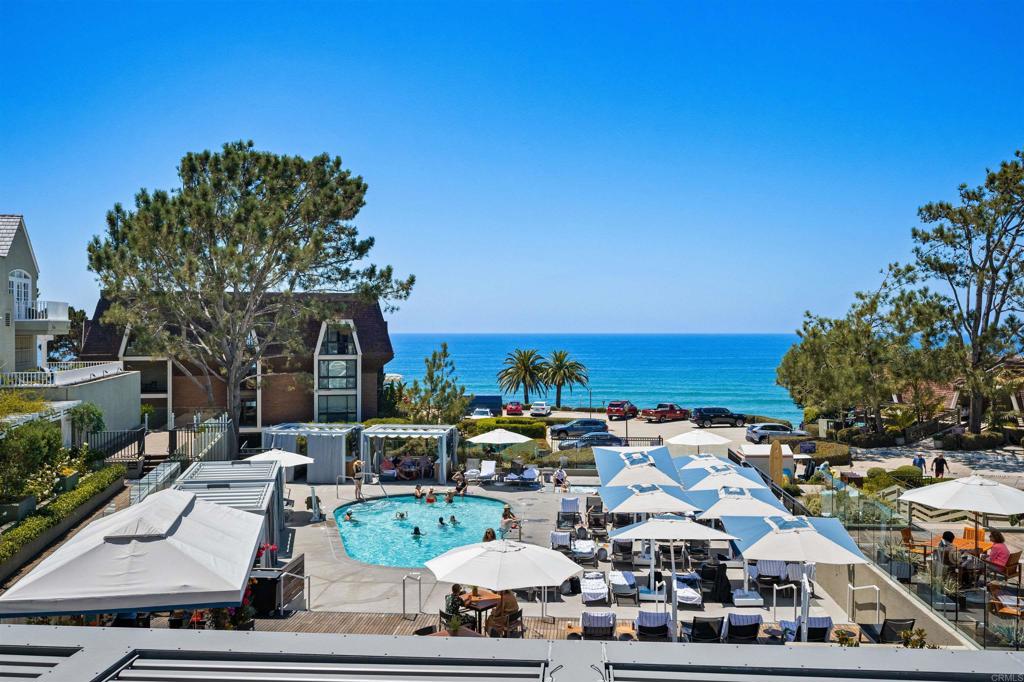 Luxury Coastal Condo in the Heart of Del Mar Village | Ocean Views & Resort Amenities. Welcome to The Sandpiper — a beautifully remodeled and turnkey 1-bedroom, 2-bathroom end-unit condo offering the best of Del Mar beach living. Located in a secure, boutique 3-story building with subterranean parking and elevator access, this rare offering includes exclusive use of L’Auberge Del Mar Resort amenities: a heated pool and spa overlooking the Pacific, 24/7 fitness center, and two tennis courts. Expertly redesigned by Jantz Construction, the interior features include: Quartz kitchen and bath countertops. Custom-built cabinets and soft-close drawers. Luxury vinyl plank flooring. Triple-pane sound-resistant windows & QuietRock drywall. Recessed LED lighting & window A/C. Full-size stackable washer/dryer. Custom blinds fitted to all windows and sliding doors. Enjoy ocean views from the dining area and balcony, along with the privacy and natural cross-breezes of a desirable end unit. The location is unbeatable — just steps to the beach, Powerhouse Park, Del Mar Plaza, fine dining, boutiques, and the iconic L’Auberge Del Mar Hotel’s restaurant and bar. Easy access to freeways, Torrey Pines Reserve, downtown San Diego, and world-class attractions makes this a perfect full-time residence or luxury second home. Live the Del Mar lifestyle — refined, walkable, and unforgettable. Professional Photo Shoot on 8/1/25