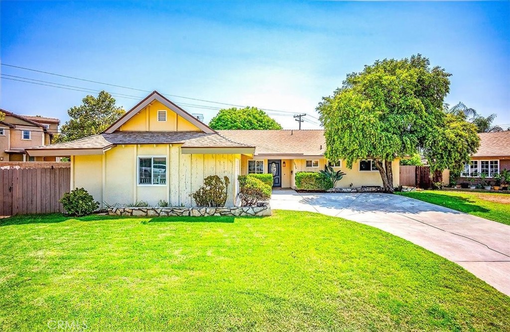 Stunningly updated end of cul de sac 4br 2ba home! This immaculate property is striking from the very first glance. The lush lawns, mature trees and glossy black leaded glass entry door create an instant welcome. Once inside, the neutral color pallet, natural colored luxury vinyl wood flooring and freshly painted walls present a light, airy feel that is both inviting and suitable for any decor. The spacious kitchen showcases a dining area, and an abundance of crisp white cabinetry, topped with quartz counters, and accentuated by new stainless appliances. The oversized peninsula is perfect for meal prep, and the pull up bar seating makes entertaining friends and family a breeze! The adjacent living room boasts a beautiful stone fireplace with both a mantle and hearth, and large sliding glass door providing an entire wall of light and views of the beautiful back yard. The South wing of the home has four large bedrooms and two updated baths, including the wonderful primary with walk in closet and attached en suite. The back yard is a paradise of thick green lawns, mature plants, and a variety of both shade a fruit bearing trees. This amazing space is perfect for a family game of soccer, entertaining friends or resting in a hammock under a shady hide away. The updated dual pane windows, new roll up garage door, finished garage and wonderful community of Riverside, make this a fantastic place to call home!!