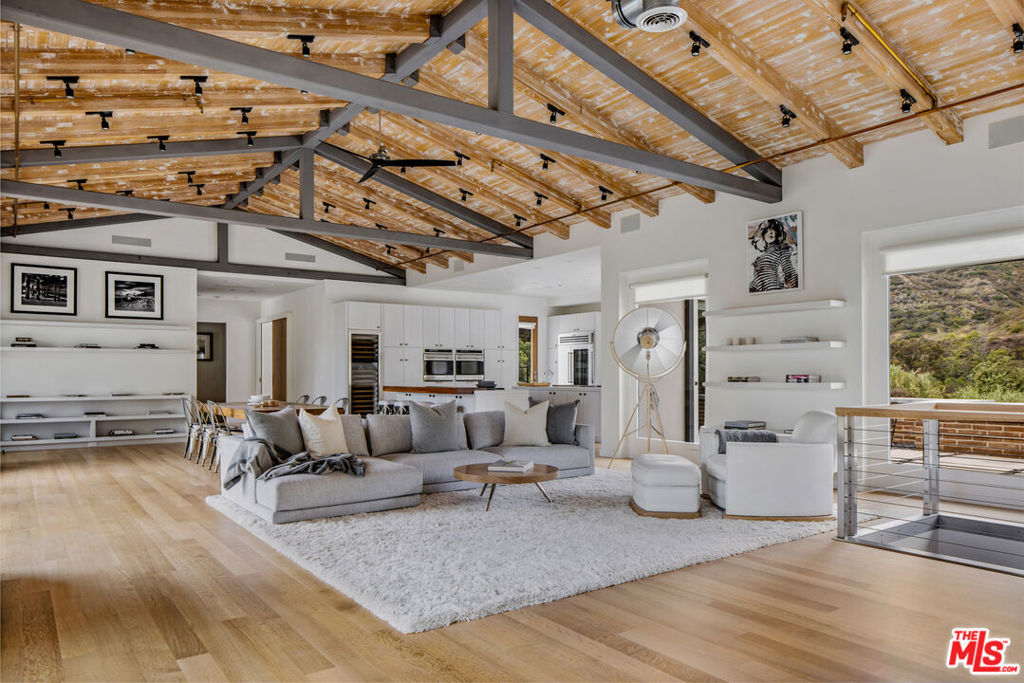 Introducing The Carbon House, an extraordinary architectural located in central Malibu. Immerse yourself in the epitome of Malibu living on approximately 4 acres of secluded paradise looking out over the Pacific ocean. This stunning residence boasts soaring 15-foot ceilings adorned with exposed beams, creating a sense of grandeur and open space. The great room seamlessly blends with the double island Chef's kitchen, which showcases custom ash wood cabinets and top-of-the-line Wolf appliances, catering to all culinary enthusiasts. Unwind in the ocean-view primary suite, opening to the outdoor patio with a plunge pool, showcasing breathtaking views of the coastal vistas. The property also offers two other bedroom suites, including a junior primary suite with a private patio. The basement level offers a media room and gym and/or playroom, catering to your individual lifestyle needs. Additionally there is a separate structure perfect for a home office or zen room. Every detail has been thoughtfully considered, from the hand-scraped oak floors to the solid walnut doors that exude timeless elegance. Indulge in awe-inspiring ocean and mountain views that envelop you from every corner of this remarkable home, offering a constant connection to the natural beauty that surrounds it. As a resident, you'll also have coveted access to La Costa Beach & Tennis rights. Experience the pinnacle of Malibu living at The Carbon House, where unparalleled craftsmanship, breathtaking vistas, and exclusive amenities merge to create an unparalleled coastal retreat. In close proximity to Nobu, Little Beach House Malibu, The Country Mart and more.