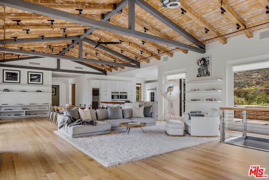 Introducing The Carbon House, an extraordinary architectural located in central Malibu. Immerse yourself in the epitome of Malibu living on approximately 4 acres of secluded paradise looking out over the Pacific ocean. This stunning residence boasts soaring 15-foot ceilings adorned with exposed beams, creating a sense of grandeur and open space. The great room seamlessly blends with the double island Chef's kitchen, which showcases custom ash wood cabinets and top-of-the-line Wolf appliances, catering to all culinary enthusiasts. Unwind in the ocean-view primary suite, opening to the outdoor patio with a plunge pool, showcasing breathtaking views of the coastal vistas. The property also offers two other bedroom suites, including a junior primary suite with a private patio. The basement level offers a media room and gym and/or playroom, catering to your individual lifestyle needs. Additionally there is a separate structure perfect for a home office or zen room. Every detail has been thoughtfully considered, from the hand-scraped oak floors to the solid walnut doors that exude timeless elegance. Indulge in awe-inspiring ocean and mountain views that envelop you from every corner of this remarkable home, offering a constant connection to the natural beauty that surrounds it. As a resident, you'll also have coveted access to La Costa Beach & Tennis rights. Experience the pinnacle of Malibu living at The Carbon House, where unparalleled craftsmanship, breathtaking vistas, and exclusive amenities merge to create an unparalleled coastal retreat. In close proximity to Nobu, Little Beach House Malibu, The Country Mart and more.