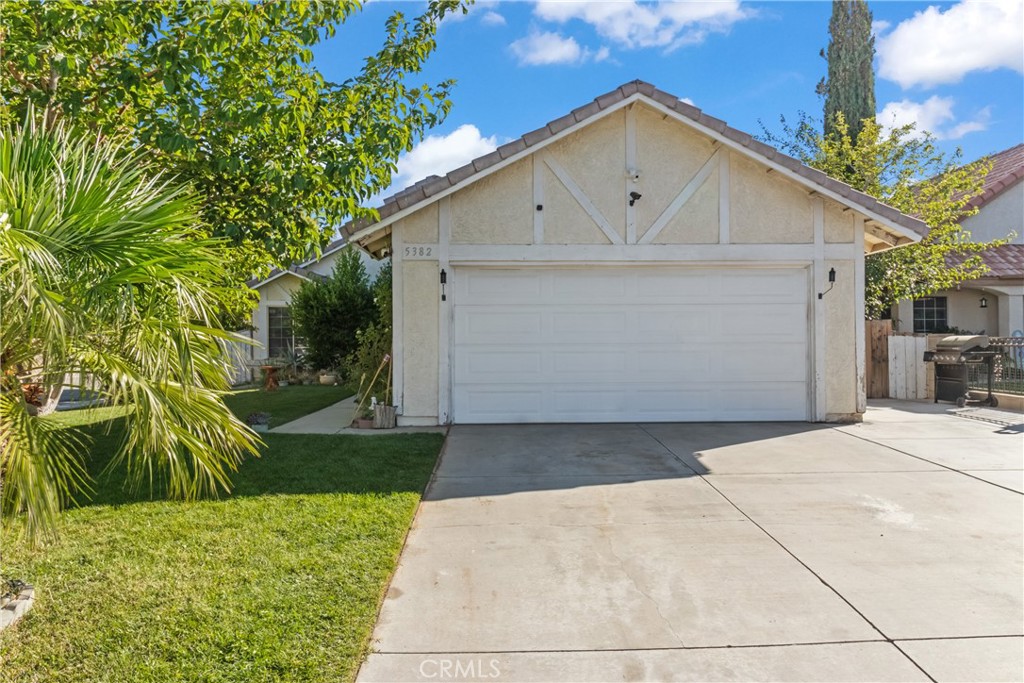 A well-maintained single-story home nestled on a peaceful, tree-lined street! Step inside to find an inviting open layout filled with natural light, vaulted ceilings, and modern flooring throughout. The cozy living room features a beautiful brick fireplace, perfect for relaxing evenings, while the adjoining dining area creates a seamless flow for entertaining. The kitchen is bright and functional with crisp white cabinetry, stainless-steel appliances, and plenty of counter space. The spacious primary suite offers direct backyard access, giving you a private retreat feel. Enjoy outdoor living in your low-maintenance backyard complete with lush turf, mature trees, and a storage shed, ideal for gatherings or simply unwinding after a long day. Conveniently located near schools, parks, and shopping, this move-in-ready home combines comfort, style, and practicality, all at an incredible value. Don't miss your chance to make this beautiful home yours!
