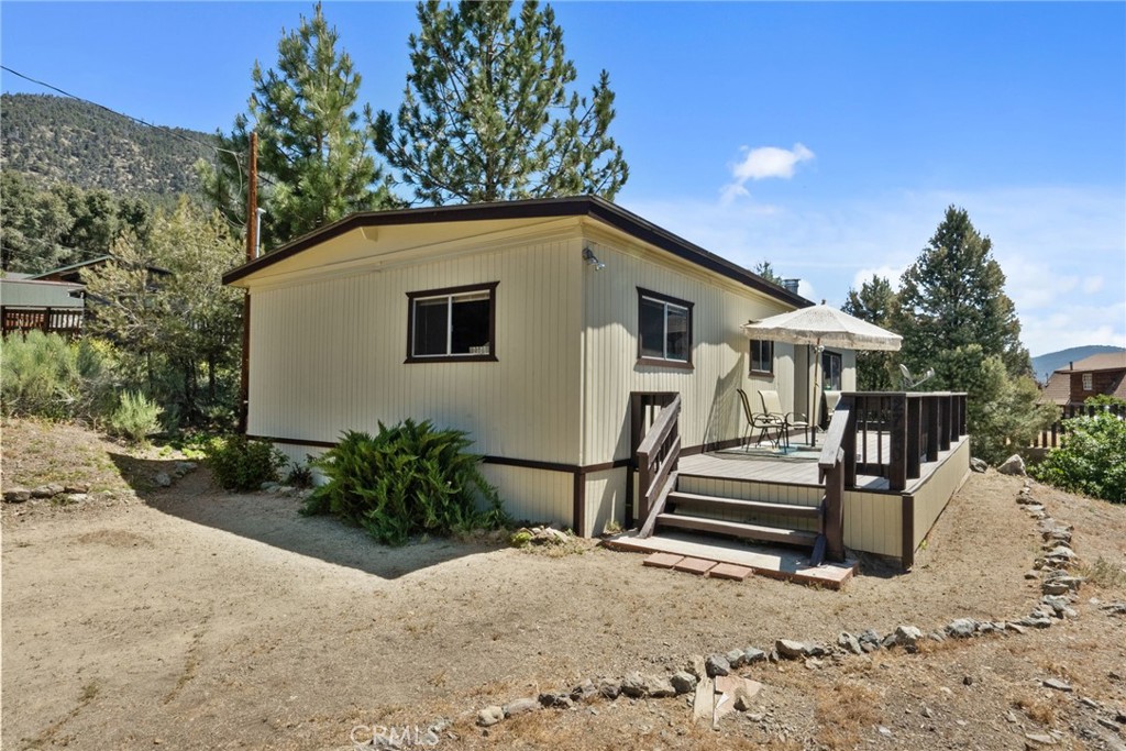 For over 50 years, this cherished home in Pine Mountain Club has been a vibrant backdrop for a family of six, a true "time capsule" from the 1970s filled with a lifetime of joyful memories.
Imagine generations of kids excitedly piling into the car, bound for adventures, escaping the rush of the LA lifestyle. Days were spent gold-panning, dreaming of striking it rich. Afternoons were filled with friendly matches on the tennis courts or the golf course, followed by refreshing dips in the community pool. Winters brought a magical transformation, with laughter echoing as snowmen were built and snowball fights waged. Every season offered an invitation to simply enjoy nature, from hiking scenic trails to stargazing.
This beloved double-wide mobile home, a comfortable 2-bedroom, 2-full bathroom abode, stands ready for new stories to unfold. Situated on an expansive 8,276 sq ft lot, there's an abundance of outdoor space just waiting for your personal touch. Picture cultivating your dream garden, or adding a play structure where future generations can create their own cherished memories. And to make your transition seamless, this charming retreat comes with furnishings included, so you can start living the Pine Mountain Club dream from day one.
Are you ready to write your own family's story in this timeless mountain escape?