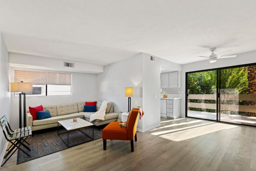 This beautiful Palm Canyon Villas Condo is light, bright, and airy. It has been freshly painted in light gray and white colors, which blend seamlessly with the new laminate flooring. The primary bedroom is spacious enough for a king-sized bed and features a private en-suite bath with a tub/shower combination and double mirrored closet doors. The secondary bedroom is flexible and would make a great den or office space.The kitchen appliances are included, and the cabinets have also been recently painted. The unit features a private laundry space on the large balcony, which also offers room for a table and chairs or a nice, oversized lounger. A lovely grapefruit tree enhances privacy and provides a scenic view.The location is highly convenient, situated close to one of the five pools and five spas, and near the tennis courts. It is within walking distance of local shopping and a drug store. The condo is just minutes from Palm Springs street festivals, dining, shopping, and excellent golf courses.Currently, 5-day short-term rentals are allowed (please verify details with the City of Palm Springs), making this an excellent investment opportunity or a perfect weekend retreat.