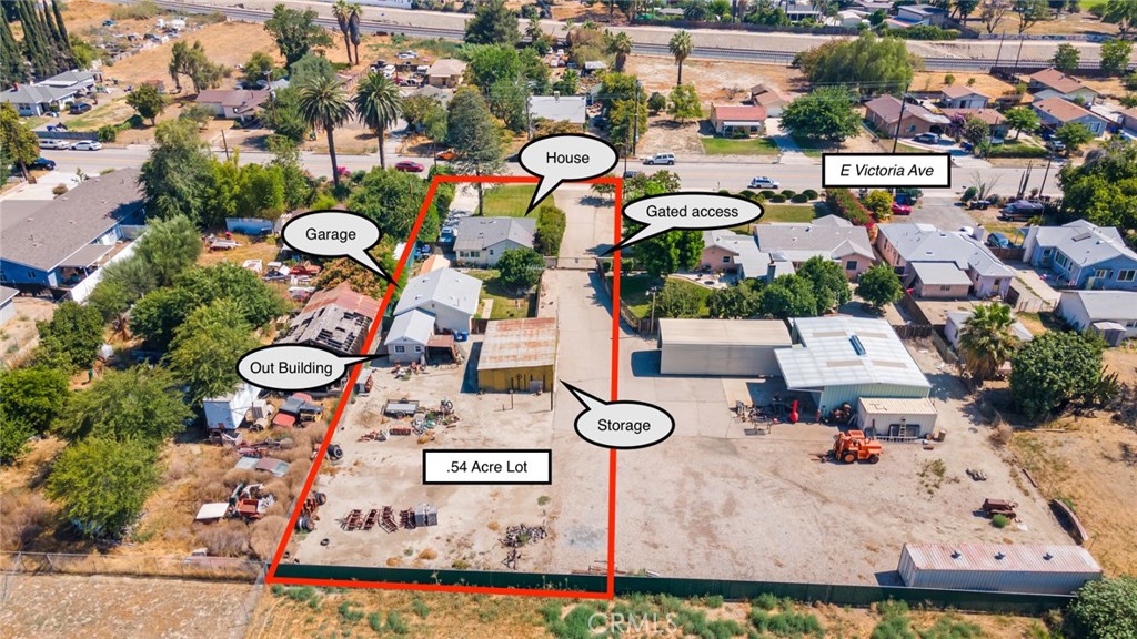 Single story, turnkey home with an oversized garage and a gated auto/storage yard on over half an acre! Located just minutes from I-10 off of Mountain View and five minutes to Mountain Grove and Citrus Plaza shopping centers, this move in ready home is in an excellent location. Enter into a large living room up front. A kitchen separates the living from the dining room. This well kept home features a newer HVAC system. A metal gate provides security and privacy for the backyard with it's own manicured lawn. The oversized garage features laudry hookups and tremendous storage space. Behind the garage is an attached out building, and there is also a four car garage on the lot. An electric gate is shared by the adjoining property, which is also for sale. Both the roof and central air were replaced in the last few years.