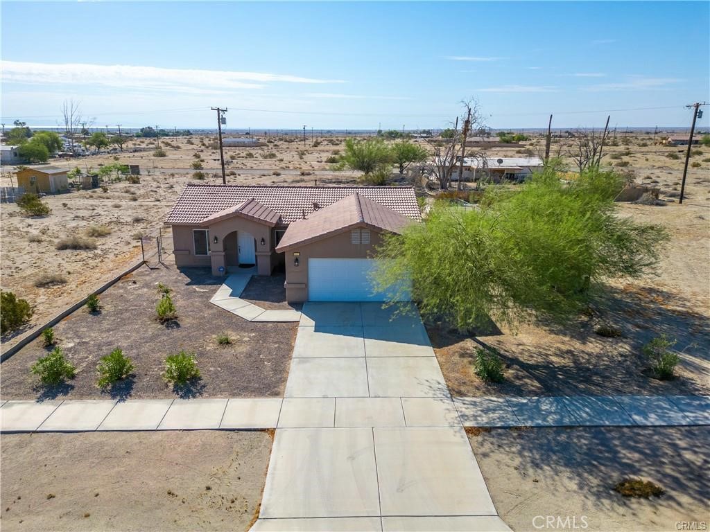 Beautiful 3-bedroom 2-bathroom home, 2 Car Garage with extra driveway space and room for RV Parking nestled in a quiet area of Thermal/Salton Sea. The Family room has an open concept floor plan with laminate flooring, ceiling fan, double pane windows and blinds throughout the home with plenty of natural light. Continuing into the Dining Room which has laminate flooring a ceiling fan and sliding doors leading to the backyard. The Kitchen features recessed lighting, tile flooring, granite counters, gas range and oven, microwave, dishwasher and plenty of cabinet and counter space. As you go down the large open hallway there is a full bathroom with a tiled shower and bathtub, vanity and tile flooring. The Master bedroom is very spacious and open with tile flooring, Dual sliding closet mirrored doors, ceiling fan and double sliding doors leading to the back yard, the bathroom has a vanity and a tile shower with bathtub. There is 2 nice sized bedrooms both with sliding mirrored closet doors, ceiling fans and tile flooring. The private laundry room has its own space with white cabinets for storage space and leads to the spacious two-car garage with a newer Water heater. The backyard has plenty of room for RV parking, Desert Toys great possibilities for you to create what you would like. The home shows pride of ownership and is ready for you to make it your own. Call to schedule an appointment.