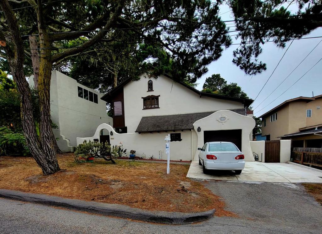Welcome to this charming home located in the beautiful city of Monterey. This residence, in the historic New Monterey area, conceptualized by former Owner/Builder with local architect, Gino Bushini, reminds passersby "that house like the Alamo" or "the nautical house", sits amongst some great history. A comfortable living space with two bedrooms and two full bathrooms, all conveniently situated on the ground floor. You'll love the open concept living room, dining area, upstairs, with the kitchen featuring lots of windows, brand new solid surface/Corian countertops, electric oven range with hood, stainless steel refrigerator, dishwasher, and large split level sink with garbage disposal. There are open-beamed/high-vaulted ceilings that create an airy and spacious atmosphere. The flooring consists of carpeted hallway and bedrooms, with vinyl/linoleum im bathrooms, as well as new luxury vinyl planks in the kitchen, dining, and living area, providing both comfort and durability. Hookups for both electricity and gas are available in the garage. The property is situated in the Monterey Peninsula Unified School District. Additional features include energy-efficient elements like floor insulation, low-flow showers over tubs and toilets, enhancing comfort and sustainability.