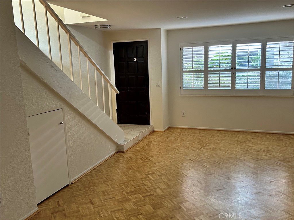 This centrally located gem in Sherman Oaks offers a spacious home. Step inside and discover a beautifully remodeled interior, starting with plantation shutters as you step down into the living room. The living room boasts a cozy fireplace, creating the perfect ambiance for relaxation and entertaining. A small, hidden cubby space for storage is also located in the living room. This home features an open floor plan that seamlessly blends the living, dining, and kitchen areas as well as a half bathroom. The laundry room with stainless steel washer and dryer that matches the dishwasher and refrigerator. A private fenced-in porch that offers privacy and an entertainment space.
Walk upstairs to two bedrooms, each with an abundance of natural light. A full bathroom with a linen closet in the hallway, and another in an en suite. One room overlooking the courtyard. The master bedroom with two closets and its own bathroom.
Two tandem parking spaces and storage in the covered parking area ensure ease and convenience.
