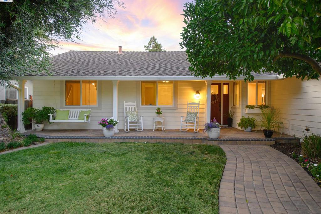 Beautifully renovated single-story home on a picturesque tree-lined street in the highly desirable Birdland community. This meticulously maintained residence features a stunning Quartzite kitchen with a large island, custom cabinets, recessed ceiling, and stainless steel GE appliances including a gas stove, refrigerator, and built-in microwave. The updated hall bath showcases a dual vanity with Quartzite counters, chrome fixtures, tile flooring, and a subway tile shower with frameless glass enclosure. Additional upgrades include newer HVAC equipment, a 40-year composition roof with heat shield attic insulation, custom stone fireplace, Milgard dual-pane windows, ceiling fans, LED lighting, crown molding, and gleaming hardwood floors throughout. The private backyard is perfect for relaxing or entertaining with an aggregate patio, wisteria-covered pergola, lush lawn, and a garden bursting with fresh tomatoes. A welcoming front porch, newer paver driveway, and walkway complete the curb appeal. Ideally located near the Sports Park, shopping, and top-rated Pleasanton schools, with easy commuter access to the ACE Train, BART, and 580/680 freeways. A true Birdland gem!