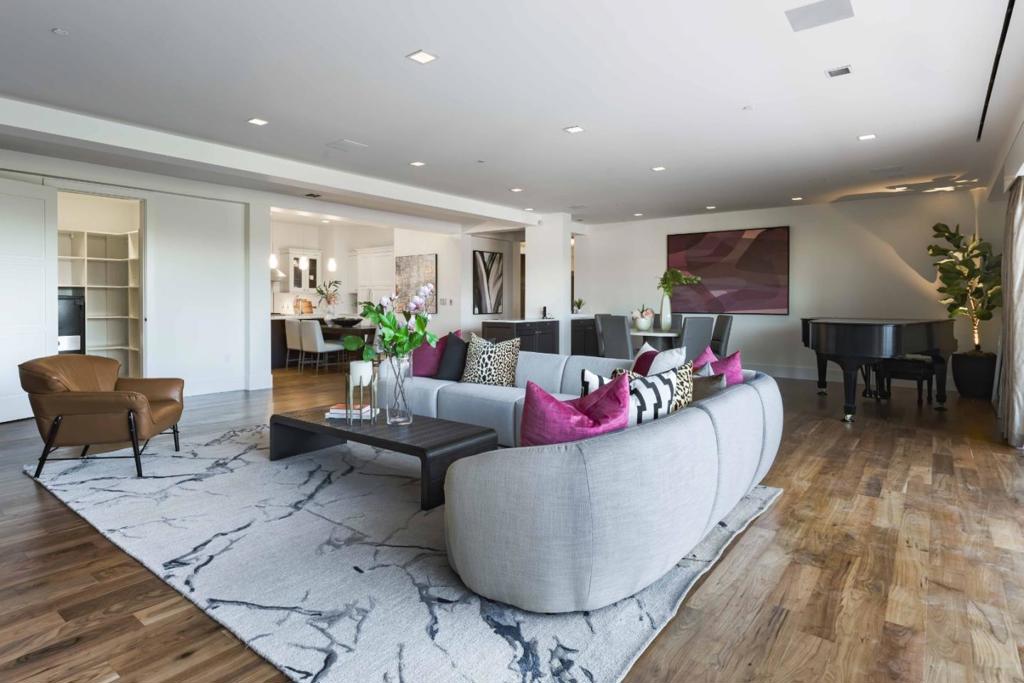 Whether as a primary residence or a pied-à-terre, this rare penthouse offers luxury living in downtown Los Altos. Set in a sleek building built in 2013, the top-level condo blends modern design with refined comfort. Espresso-hued walnut floors, high ceilings, and elegant millwork define the interiors, while vast expanses of sliding glass open the living space to a tremendous terrace, perfect for entertaining or quiet evenings at home. The open concept floor plan includes a chefs kitchen with Thermador and Miele appliances, a media room, office, and spacious living and dining areas anchored by a fireplace. Both bedroom suites open to the terrace, including a luxe primary with fireplace and spa-like bath. Additional highlights include a laundry room, secure building access with elevator, air conditioning, dedicated underground parking, and a private storage unit. All just moments from parks, shops, restaurants, and top commute routes, this is downtown Los Altos living at its finest.