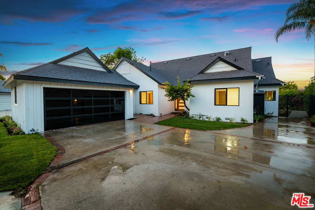 Welcome to 3744 Vineland Avenue, an exceptional, fully reimagined residence South of the Boulevard in the heart of Studio City. This stunning home has been completely reconfigured and remodeled from top to bottom, offering 5 bedrooms and 6 bathrooms across approximately 2,470 square feet of refined living space on a generous 7,628 square foot lot. Step inside to discover wide plank white oak hardwood floors throughout and an open floor plan designed for modern living. The expansive chef's kitchen features top of the line appliances, kitchen nook, a large center island, quartz countertops, wine fridge, and custom pantry, seamlessly flowing into the formal dining and living areas. Oversized sliding glass doors open to a spacious covered deck, creating the perfect indoor-outdoor living experience.Upstairs, a versatile bonus room opens to a large terrace with sweeping views of the valley and surrounding mountains, ideal for work, play, or relaxation. The primary suite offers a luxurious retreat with a spa inspired bathroom and serene ambiance. Freshly landscaped grounds, a two car garage, and a prime location just moments from Ventura Boulevard's shops, dining, and entertainment complete this impressive offering. A rare Studio City gem blending luxury, lifestyle, and location.