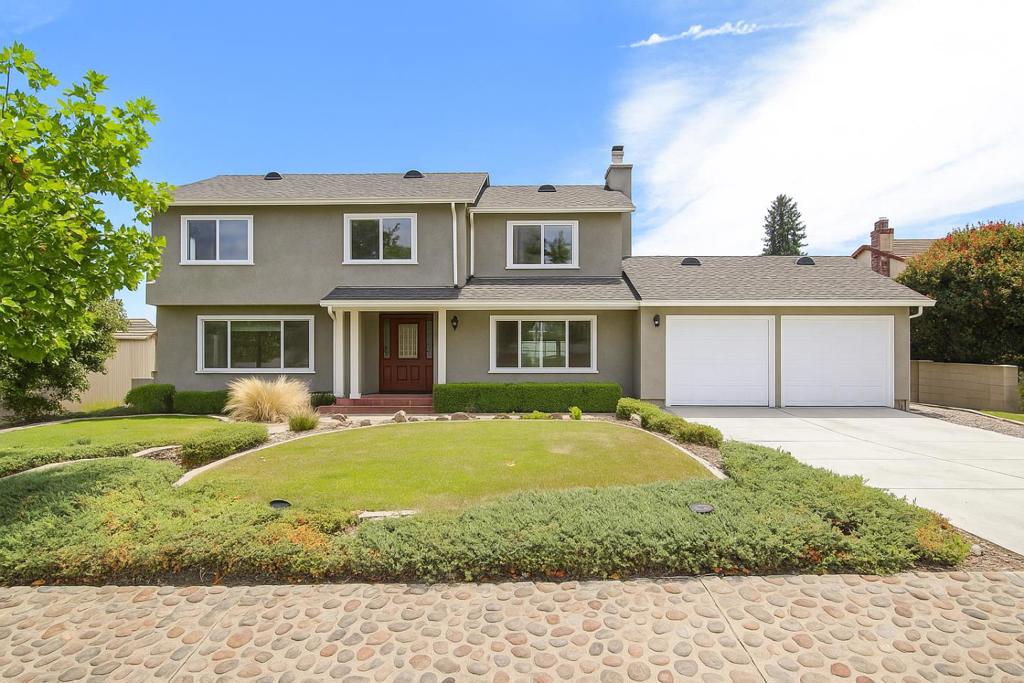 Perched in the desirable Jackson Oaks neighborhood, this home offers sweeping city lights views over Morgan Hill and a spacious 19,000 sq ft lot ideal for entertaining, relaxing, or reimagining your dream home. This 4-bedroom, 2.5-bath two-story home features a classic layout with hardwood flooring on the main level, cozy carpet upstairs, and charming details throughout. Enjoy a spacious living room with a bay window, a cozy stone fireplace in the den with vaulted wood beam ceilings, and a kitchen equipped with granite countertops, stainless steel appliances, double ovens, and a wine fridge. Step outside to your private backyard retreat complete with a built-in pool, jacuzzi, diving board, and an elevated deck perfect for summer entertaining. With a little TLC, this 1979-built home can truly shine offering both character and potential in one of Morgan Hills most scenic hillside communities. Two-car garage included. Just minutes from shopping, dining, and downtown Morgan Hill.