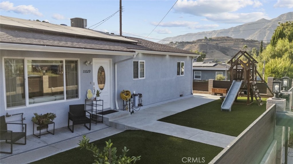 This fully renovated 2-bedroom, 2-bathroom residence offers 1,140 sqft of bright, modern living space in a quiet, sought-after neighborhood. Step inside to find an open, airy layout with sun-filled rooms, sleek finishes, and thoughtful updates throughout. The spacious living area flows seamlessly into a contemporary kitchen featuring modern cabinetry and ample workspace. Enjoy the convenience of an in-unit washer and dryer, included solar panels to help lower energy costs, and water included in the lease. The primary suite is a true retreat with a walk-in closet and private bath. The backyard features a covered patio complete with an outdoor sink and stove. Two large storage sheds provide plenty of extra space. Located near local shops, dining, and parks, this home combines style, comfort, and convenience. Note: Property has an attached 1-bedroom ADU that is currently rented.