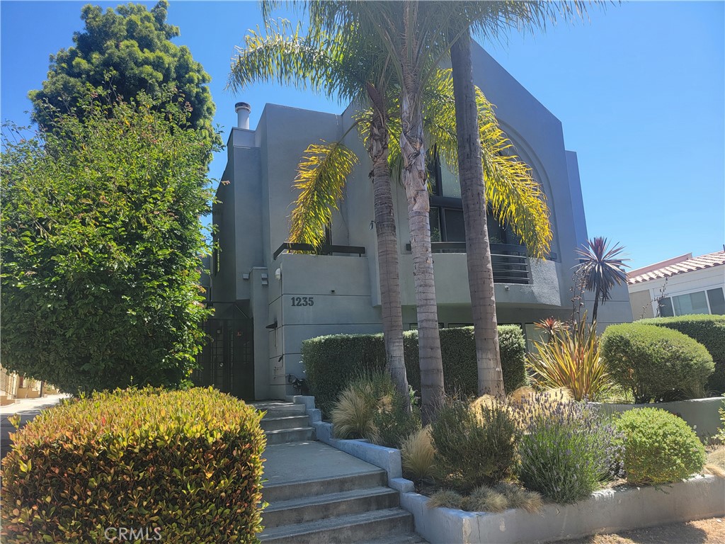 Wow! This is a spacious and recently renovated (including soundproofing) 2 bedroom 3 bath condo in lovely Santa Monica! Upon entering you may notice the open-concept feeling, beautiful wall-to-wall hardwood flooring, and a wood-burning fireplace in the living room. There is a dining room area that leads to one of the outdoor areas. The kitchen has top-of-the-line appliances with plenty of counter space and cabinets. The bedrooms are spacious and there is also an Loft/Office area, 2 balconies and a private garden. Finally, there is a laundry room and a private garage. All this with great "walkability" and "bikeability" scores!