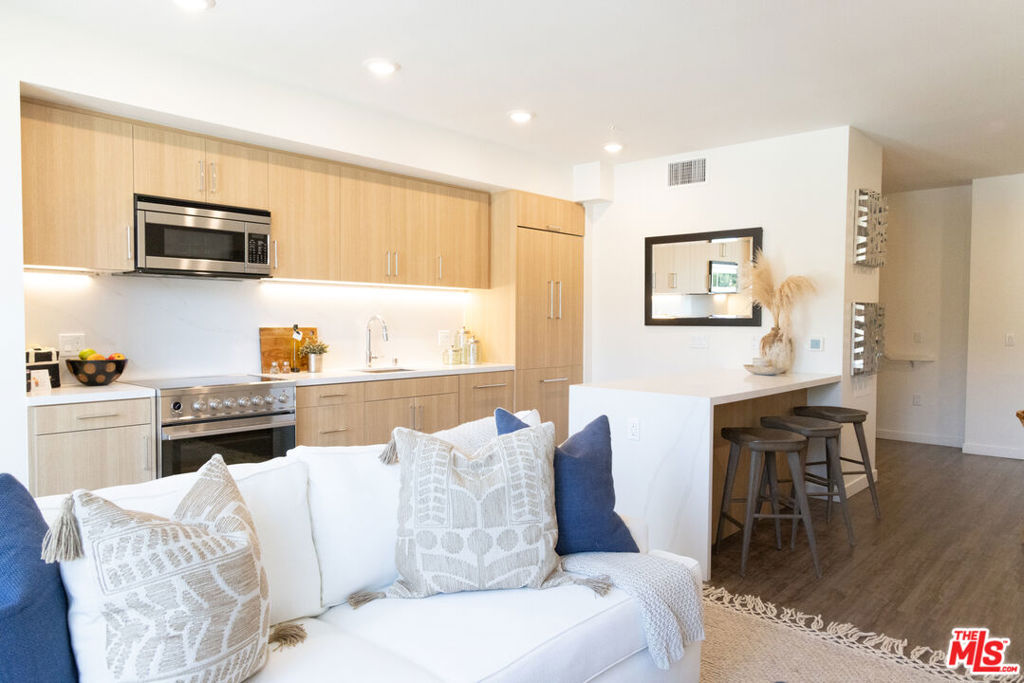 Welcome to your brand new penthouse townhome, where luxury living meets the vibrant pulse of everyday lifestyle. Nestled amidst nature yet close to city conveniences, this brand new two-story unit is equipped with smart home technology and upscale finishes. One of the biggest units in the building, this three bedroom and four bath home faces south and includes two spacious patio balconies with views of the Hollywood Hills and beyond. The building offers the most sought after amenites, with access to two pools, two fitness studios, two lounges, underground parking, EV chargers and much more. With curated ground-floor retail coming soon adding convenience to your daily routine. Surrounded by local dining, shops, art galleries, entertainment venues, and more. Please inquire about move-in specials. Several different units and pricing available. Some photos may be of similar units.