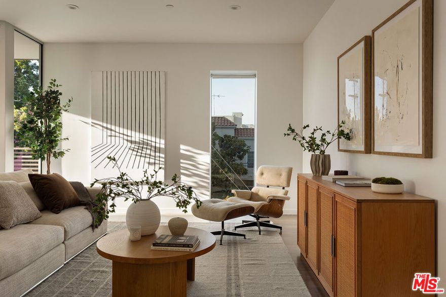 Luxury condo in prime Studio City! This 3rd-floor residence offers an open, light-filled layout with high ceilings and updated wide plank wood flooring throughout. The spacious living room flows seamlessly to a private balcony, perfect for morning coffee or evening relaxation. The updated kitchen boasts Caesarstone and porcelain countertops, stainless steel appliances, and sleek wood cabinetry. With two bedrooms, two full bathrooms, plus a powder bath, the home provides both comfort and functionality. The primary suite includes an oversized custom storage unit and ensuite bath. Featuring designer finishes throughout, this residence also offers in-unit laundry, central HVAC, and two tandem parking spaces + an additional storage unit in a gated garage. The building provides secure entry and inviting common areas. Set in a highly desirable Studio City pocket, you're steps from Ventura Blvd's best dining and cafes, and just a short walk to the newly reimagined Sportsmen's Lodge with Erewhon, Sugarfish, Equinox, and more. A rare opportunity to enjoy comfort, style, and convenience in one of the Valley's most sought-after neighborhoods.