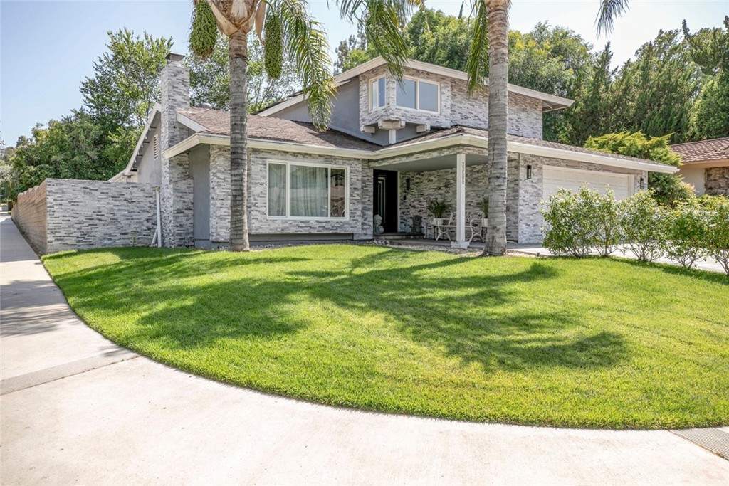This stunning 5-bedroom, 3-bathroom home offers solar, the perfect blend of comfort, style, and outdoor luxury. Situated on a generous 8,500+ sq ft lot, it's ideal for entertaining and relaxing alike.
Step through a custom-made wrought iron front door into a bright, open space with high ceilings and modern laminate floors. The staircase features elegant custom glasswork, while the newly renovated kitchen impresses with glossy cabinets, hand-picked stone countertops and backsplash, a custom-built island, and sleek European-style interior doors.
All bathrooms are oversized and fully remodeled, offering spa-like comfort with contemporary finishes. Enjoy your morning coffee or family dinners with serene views of the pool and lush backyard.
Step outside to your private covered seating area, complete with recessed lighting, custom tile work, and a mounted TV — perfect for year-round outdoor living. The breathtaking mini pebble pool and jacuzzi set the scene for unforgettable summer gatherings.
The backyard has been fully upgraded with custom tile throughout, a new drainage system, and towering palm trees that add a touch of paradise. Surrounded by brick walls, this outdoor space offers complete privacy and a true resort-style feel.