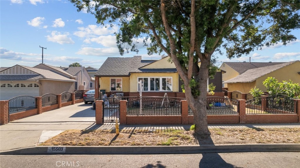 4 bed 2 bath home offering over 1400 square feet of well designed living space in the heart of Norwalk. This charming residence features beautiful flooring throughout and ceiling fans that enhance comfort in each room. The full kitchen provides ample counter and cabinet space, ideal for everyday cooking and meal preparation. All bedrooms are generously sized with plenty of closet space, creating a practical and comfortable layout for daily living. The home is gated and includes both a front and back yard, perfect for outdoor activities, gardening, or relaxation. A detached garage adds convenience and additional storage. This is a wonderful opportunity to own a spacious and private home in a desirable neighborhood.